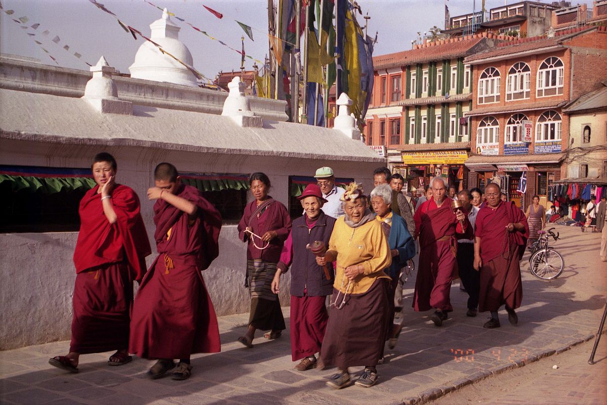 Kathmandu Boudhanath 18 Monks and Pilgrims Circumambulate Stupa The local Tibetan population, including monks, nuns and pilgrims circle the Boudhanath Stupa all day long.